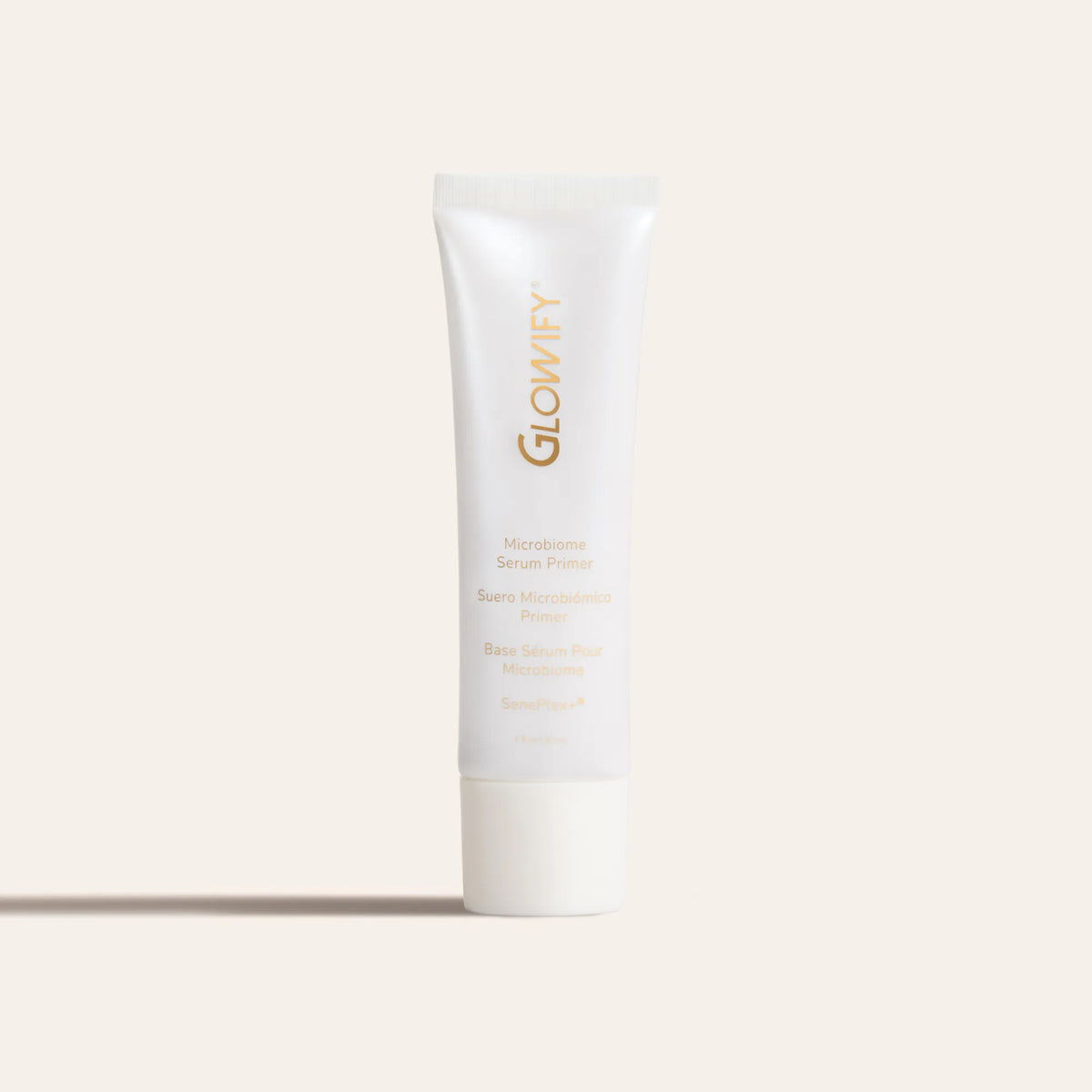 Glowify® Microbiome Serum Primer by SeneGence: A white primer tube with gold lettering.