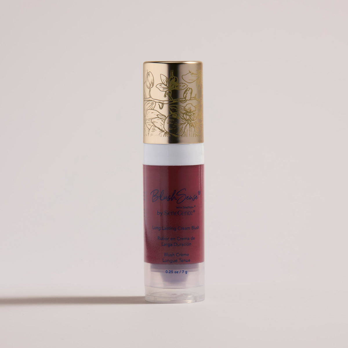 BlushSense® Cream Blush by SeneGence: a clear tube of deep berry-red cream blush with a white collar and an orchid-engraved gold cap.