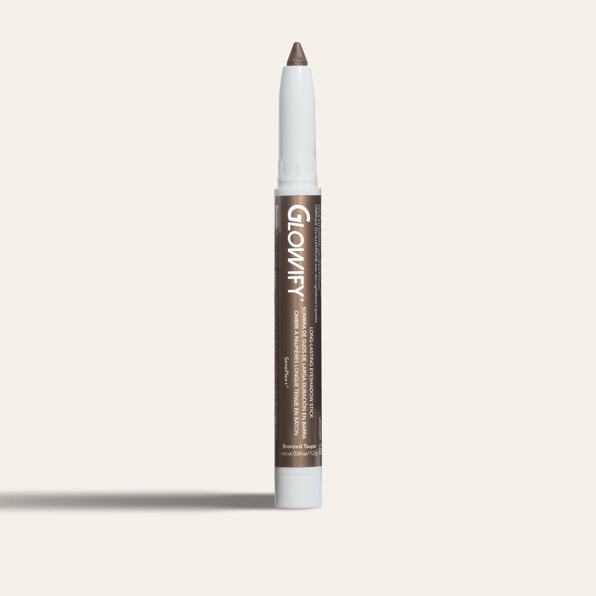 Glowify® Long-Lasting Eyeshadow Stick by SeneGence: A brown eyeshadow stick with white ends and an exposed tip.