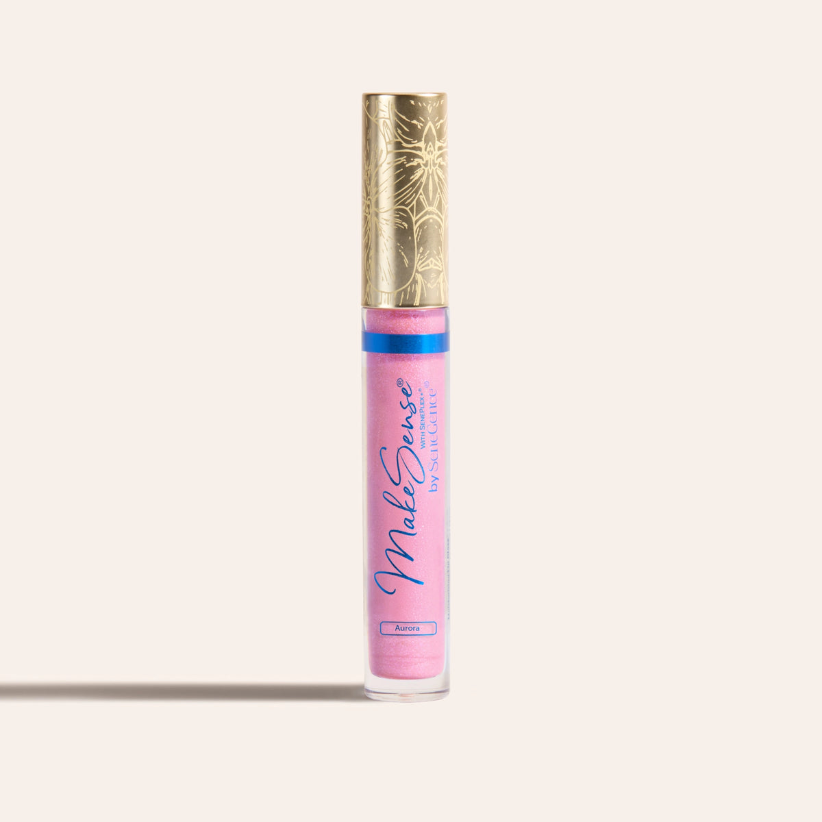MakeSense Pearlizer Highlighter Wand by SeneGence: a slim tube of shimmering pink highlighter with a blue band and a tall gold orchid-engraved cap.