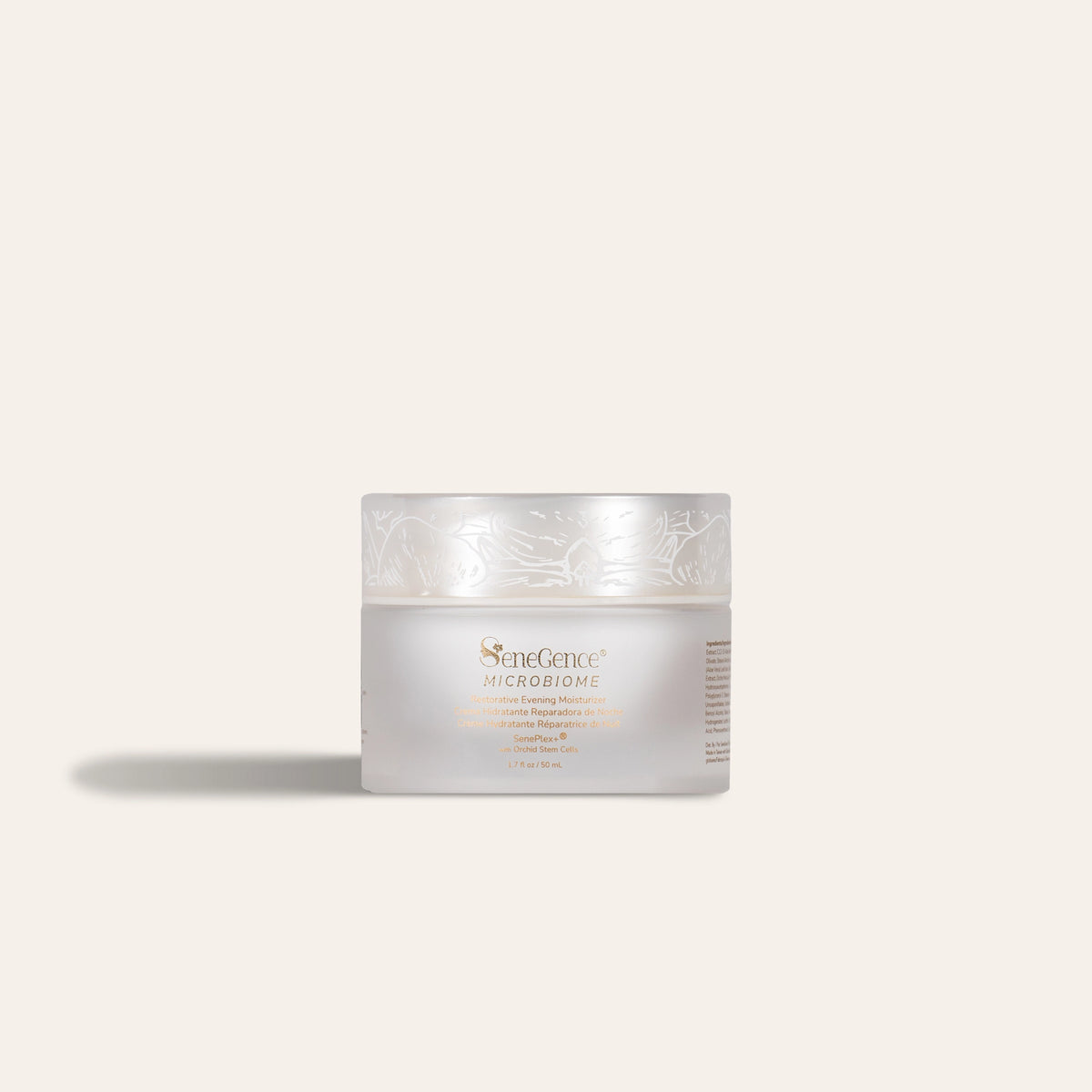 Microbiome Restorative Evening Moisturizer by SeneGence: a squat frosted-white jar with a pearl-white lid printed with white orchid line art and gold-tone label text.