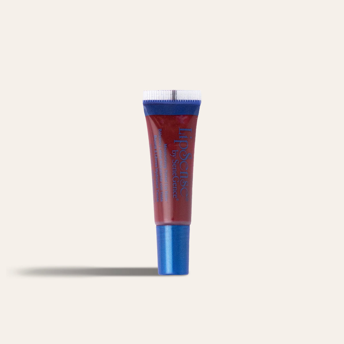 LipSense® Moisturizing Lip Balm by SeneGence: A red balm tube with a blue cap.