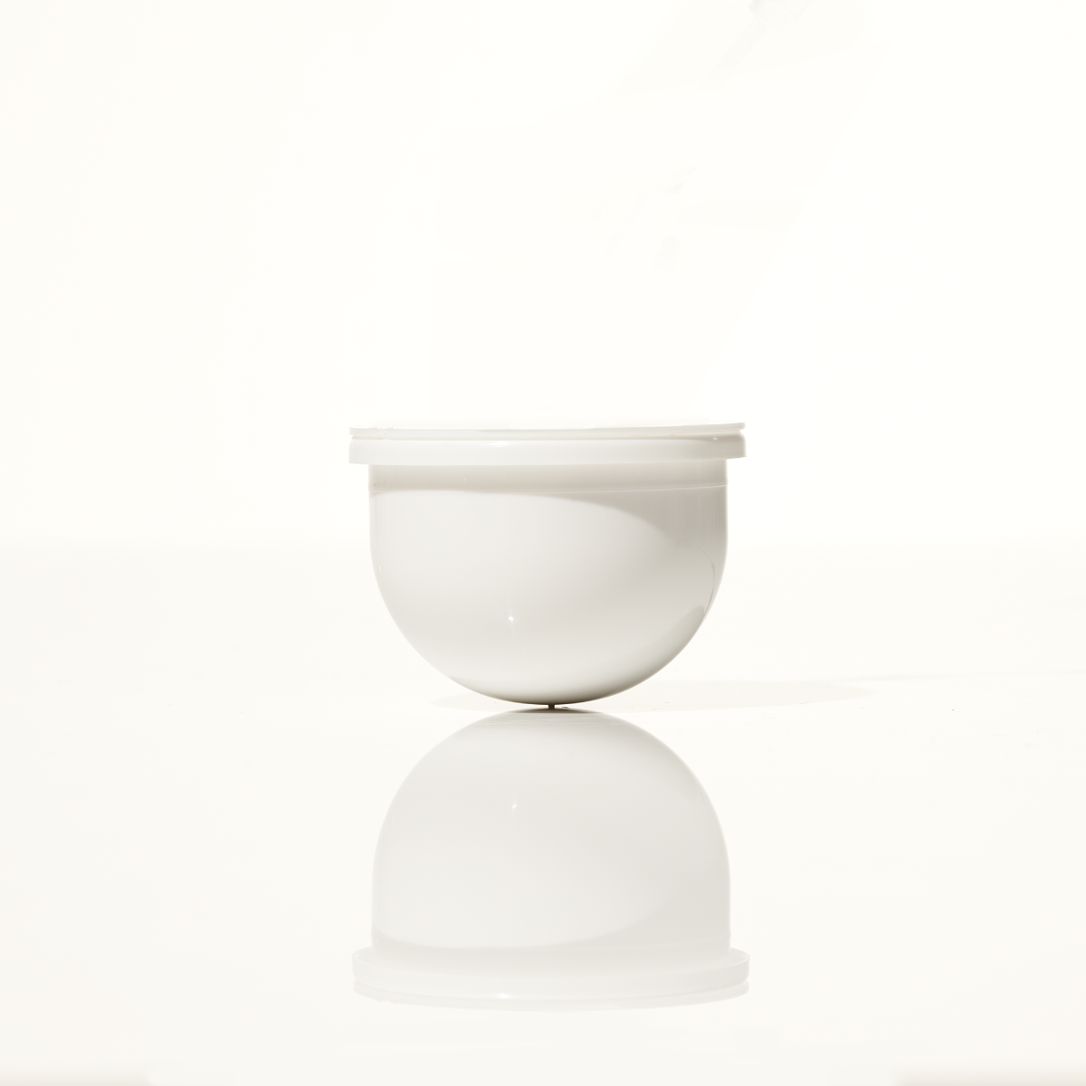 Microbiome Restorative Evening Moisturizer Refill Pod by SeneGence: A white round moisturizer refill pod.