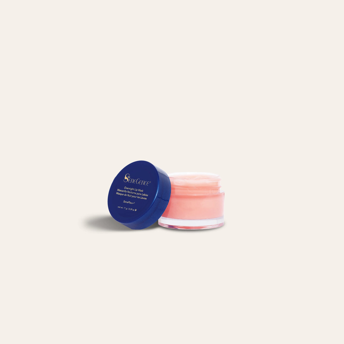 Overnight Lip Mask by SeneGence: An open pot of pink lip mask beside a blue lid.