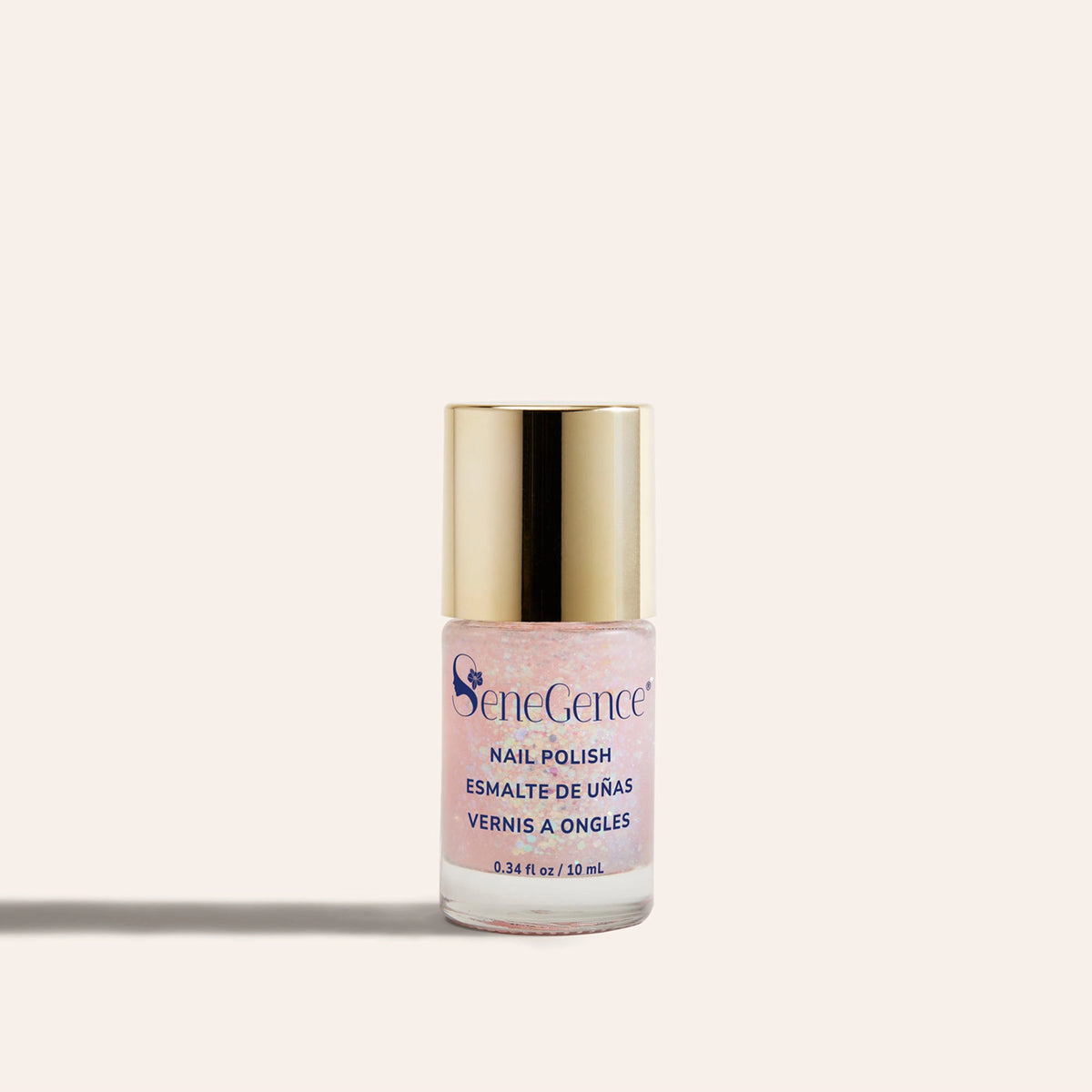 Sparkle & Sleigh Nail Polish by SeneGence: A clear bottle of sparkling pink nail polish with a gold cap.